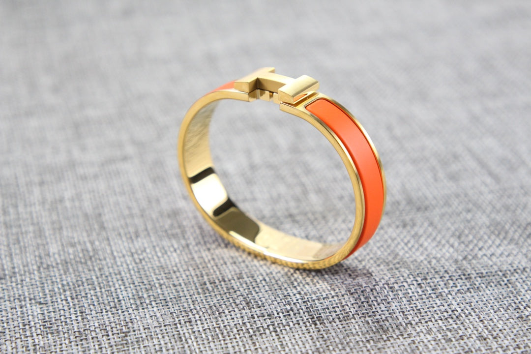 Hermès Clic H Orange - vista lateral